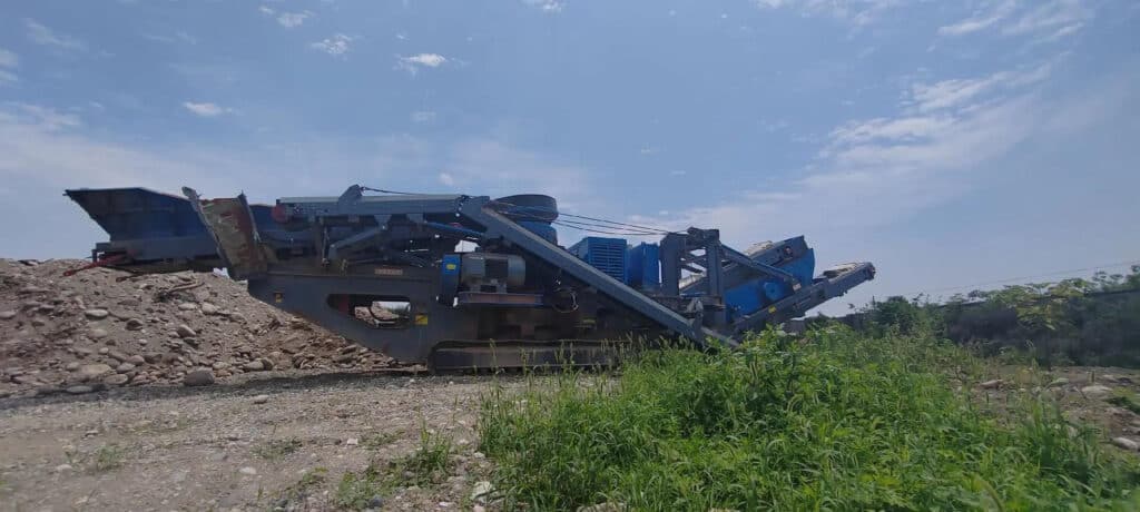 XCRUSHER customer's XC300 mobile cone crusher is in the sand and gravel crushing site